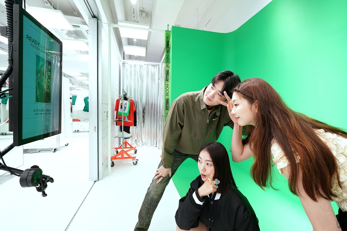 Nike Style Hongdae Content Capture Booth. Three young asian people posing for a camera against a green screen
