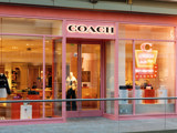 Coach Storefront City Creek Utah with neon sign of handbag and the text salt lake city