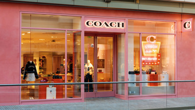 Coach Storefront City Creek Utah with neon sign of handbag and the text salt lake city